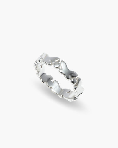 You've Changed ring in 925 sterling silver, band of butterflies, angled view