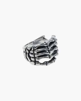 Good Bones ring in stainless steel, skeletal hand wrapped around the finger, front view