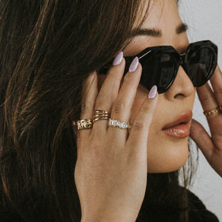Icy Wifey ring worn: person in sunglasses wearing stacked rings