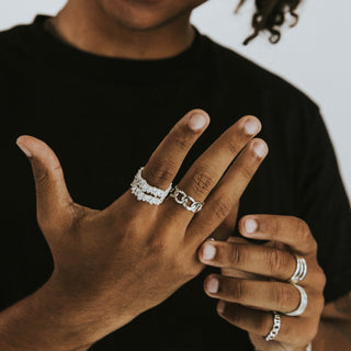 Chain Reaction ring worn: hand wearing silver rings including a chain ring
